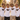 Braeutigam-Crew in Retro-Regenbogen-Shirts im goldenen Abendlicht