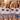 Braut-Crew in weissen JGA T-Shirts mit Retro-Regenbogen-Schriftzug Braut Crew bei goldener Stunde