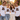 Gemischte JGA Crew in weissen T-Shirts mit Retro-Regenbogen-Schriftzug Verliebt Verlobt Verbunt bei goldener Stunde