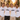 Braeutigam-Crew in weissen JGA T-Shirts Der Braeutigam im Regenbogen-Rahmen bei goldener Stunde