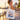 Person mit Duesseldorf-Grand-Tour-Jutebeutel an der Rheinuferpromenade vor Rheinturm und Medienhafen