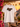 Weisses JGA T-Shirt Braeutigam Crew Retro Regenbogen auf Kleiderbuegel in Sunset-Ambiente an Amalfikueste