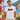 Mann traegt weisses JGA T-Shirt mit Retro-Regenbogen-Schriftzug Braeutigam auf Positano-Balkon in goldenem Abendlicht