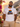 Mann traegt weisses JGA T-Shirt Heute bunt Morgen verheiratet Retro Regenbogen auf Positano-Balkon