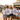 JGA Orga-Crew am Bulli in weissen All Access Crew-Pass Shirts