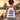 Person mit Cologne-Pride-Turnbeutel am Rheinboulevard vor Dom und Hohenzollernbruecke