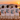 JGA-Crew mit Ibiza-Grand-Tour-Shirts über dem Hafen von Ibiza-Stadt bei Sonnenuntergang