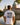Mann mit Hannover-Grand-Tour-Shirt am Maschteich vor dem Neuen Rathaus – Rückenprint Städte-Collage