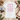 Leipzig JGA Damen-Shirt Flatlay — rosa Rueckenprint mit Leipziger Wahrzeichen, Butterkekse, Notenblatt, Rathaus-Postkarte