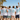 JGA Crew mit Mallorca T-Shirt am Strand mit Palmen und türkisem Meer