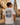 Mann mit Münster-Grand-Tour-Shirt am Prinzipalmarkt – Rückenprint Städte-Collage