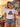 Frau traegt weisses JGA T-Shirt Heute bunt Morgen verheiratet Retro Regenbogen auf Positano-Balkon