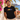 Mann trägt schwarzes JGA T-Shirt mit LGBIERTQ+ Retro-Pride-Print auf Mallorca-Terrasse