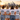 JGA-Damencrew mit Main-Crew-Frankfurt-Shirts am Mainufer vor der Frankfurter Skyline
